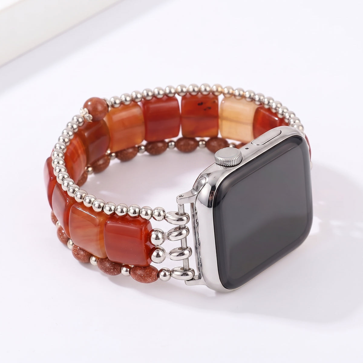 Cinturino elastico per Apple Watch in corniola Desert Flame, color argento