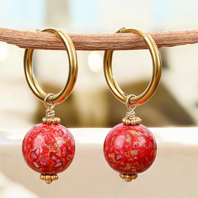 Orecchini a cerchio con sfera maculata Crimson Orbit