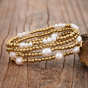 Set di bracciali in oro e perle