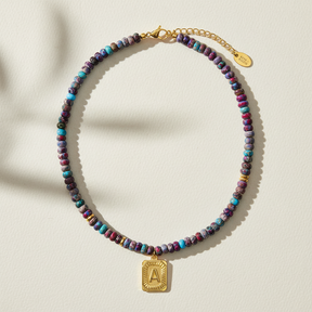 Collana a bolla con iniziale e gemma vivace